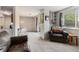 Open-concept living space featuring neutral paint, plush carpets and ample natural light at 709 Arrow Ct, Lafayette, CO 80026