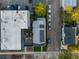 Aerial view of home with solar panels and a fenced front yard at 544 N Logan St, Denver, CO 80203