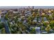 Stunning aerial view of a residential neighborhood with the city skyline in the background, showcasing an ideal location at 544 N Logan St, Denver, CO 80203