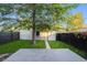 Backyard featuring a gray deck, lawn and wood privacy fence at 544 N Logan St, Denver, CO 80203