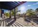 View from a balcony overlooking a neighborhood street with tree coverage at 544 N Logan St, Denver, CO 80203