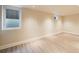 Spacious basement featuring recessed lighting, light wood flooring and an egress window at 544 N Logan St, Denver, CO 80203