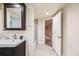 Bathroom featuring a tiled shower/tub and a black vanity with integrated sink at 544 N Logan St, Denver, CO 80203