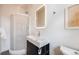 Contemporary bathroom featuring a sleek vanity, modern mirror, stylish lighting, and a glass-enclosed shower at 544 N Logan St, Denver, CO 80203