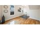 Bright bedroom featuring hardwood floors, white walls, stylish decor, and natural light at 544 N Logan St, Denver, CO 80203