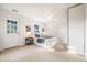 Sunny bedroom with a queen bed, ceiling fan, and natural light at 544 N Logan St, Denver, CO 80203