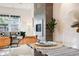 Elegant dining area adjacent to the living room, featuring a modern fireplace and stylish decor at 544 N Logan St, Denver, CO 80203