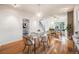 Bright dining room featuring hardwood floors, modern chandelier, and seamless access to the living area at 544 N Logan St, Denver, CO 80203