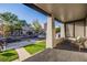 Spacious front porch offers a welcoming view of the street with well-maintained lawns and mature trees at 544 N Logan St, Denver, CO 80203