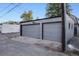 Two car detached garage with two bays and gray doors at 544 N Logan St, Denver, CO 80203