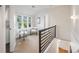 Cozy hallway featuring neutral colors, modern railings, and ample light at 544 N Logan St, Denver, CO 80203