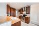 Stylish kitchen with stainless steel appliances, butcher block countertops, wooden cabinets, and tile flooring at 544 N Logan St, Denver, CO 80203