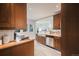 Bright kitchen showcasing wooden cabinets, stainless steel appliances, butcher block countertops, and tile flooring at 544 N Logan St, Denver, CO 80203