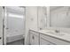 Bathroom featuring a double sink vanity and a large mirror. Modern fixtures at 1876 Chaffee Crest Dr, Berthoud, CO 80513