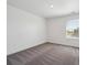 Bedroom featuring neutral decor, plush carpet, and a window at 1876 Chaffee Crest Dr, Berthoud, CO 80513