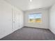 Bedroom with natural light and plush carpet at 1876 Chaffee Crest Dr, Berthoud, CO 80513