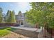 Exterior view of the home featuring a patio area, hot tub, and a well-maintained yard at 418 Hayloft Way, Brighton, CO 80601