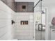 Modern bathroom with a glass shower and a view into the bedroom at 418 Hayloft Way, Brighton, CO 80601