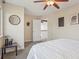 Bright bedroom with a full bed, a view of the landing, and natural light from a large window at 418 Hayloft Way, Brighton, CO 80601