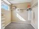 Walk-in closet featuring built-in shelving and ample storage space at 418 Hayloft Way, Brighton, CO 80601