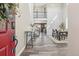 Grand foyer with high ceilings, wood-look tile flooring, and a view of the dining area, creating an inviting entry at 418 Hayloft Way, Brighton, CO 80601