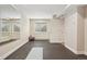 Bright home gym featuring mirrored wall, durable rubber flooring, and dual windows at 418 Hayloft Way, Brighton, CO 80601