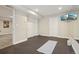 Spacious home gym with mirrored wall and rubber floor; perfect for workouts and fitness at 418 Hayloft Way, Brighton, CO 80601