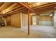 Unfinished basement featuring exposed wood beams and a concrete floor ready for customization at 160 Las Lunas St, Castle Rock, CO 80104
