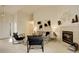 Bright living room boasts high ceilings, neutral walls, a fireplace, and stylish, modern furnishings at 160 Las Lunas St, Castle Rock, CO 80104