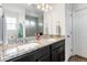 Dual-sink bathroom features granite countertops and modern fixtures at 239 S Old Hammer St, Aurora, CO 80018