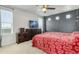 Primary bedroom features a modern gray accent wall and ample natural light at 239 S Old Hammer St, Aurora, CO 80018