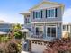 Charming two-story home with a private balcony above the garage and beautiful blue horizontal siding at 239 S Old Hammer St, Aurora, CO 80018