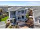 Two-story home showing curb appeal, a front porch, and is nestled in a vibrant neighborhood at 239 S Old Hammer St, Aurora, CO 80018