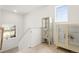 Light-filled hallway showcases display cabinets and natural light at 239 S Old Hammer St, Aurora, CO 80018