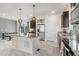 Spacious kitchen with granite countertops, an island and adjacent dining area at 239 S Old Hammer St, Aurora, CO 80018