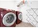 Laundry room boasts a modern Samsung washer and dryer, and convenient drying rack at 239 S Old Hammer St, Aurora, CO 80018