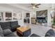 Open-concept living room flows into the kitchen with modern finishes at 239 S Old Hammer St, Aurora, CO 80018