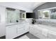 This bathroom features a double sink vanity, soaking tub, and stylish fixtures at 505 Detroit St, Denver, CO 80206
