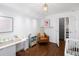 Bright Bedroom features hardwood floors, modern lighting, changing table, and stylish decor at 505 Detroit St, Denver, CO 80206