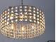 Elegant chandelier with caged shade and orb accents provides ambient lighting to the room at 505 Detroit St, Denver, CO 80206