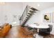 Open floor plan with modern dining area, staircase, hardwood floors, and access to the backyard at 505 Detroit St, Denver, CO 80206