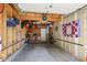 Functional garage interior offering space for vehicles, storage cabinets, and various equipment at 505 Detroit St, Denver, CO 80206