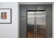 Stainless steel refrigerator and gray cabinets provide ample kitchen storage at 505 Detroit St, Denver, CO 80206