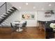 Open-concept living space with modern dining area and staircase at 505 Detroit St, Denver, CO 80206