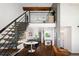 Open concept living space with dining area, staircase, and kitchen at 505 Detroit St, Denver, CO 80206