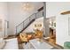 Spacious living room featuring a staircase, open layout, and stylish furnishings at 505 Detroit St, Denver, CO 80206