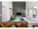 Bright living room with a decorative fireplace, hardwood floors, modern furniture, and lots of natural light at 505 Detroit St, Denver, CO 80206
