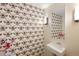 Unique powder room featuring whimsical bee wallpaper, a modern sink, and sleek lighting fixtures at 505 Detroit St, Denver, CO 80206