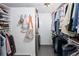 A walk-in closet with custom shelves and rods for storing a wardrobe at 505 Detroit St, Denver, CO 80206