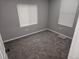 Cozy bedroom with carpet, two windows, and neutral paint at 4673 Sherman St, Denver, CO 80216